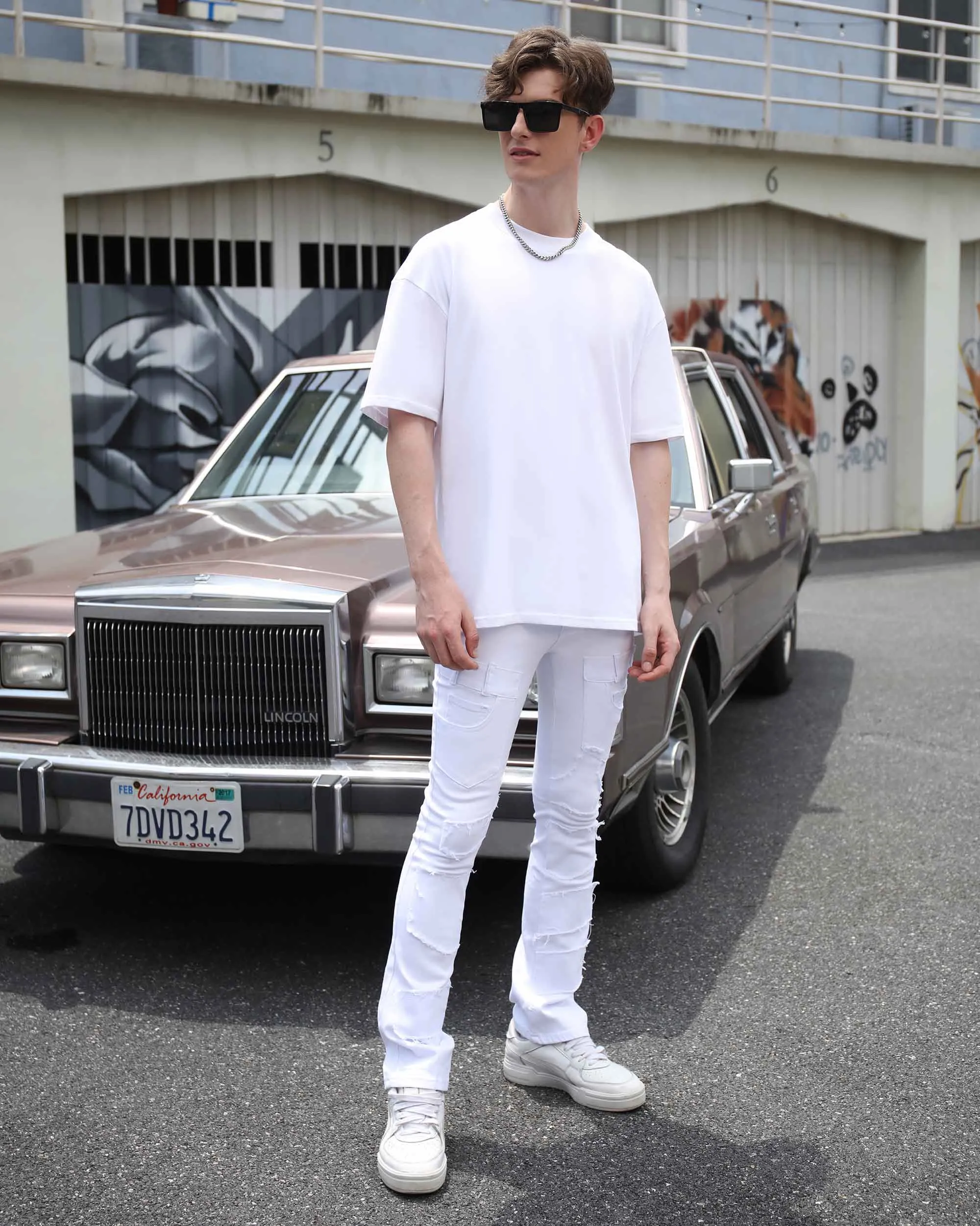 Vintage White Flared Jeans with Raw-Edged Accents